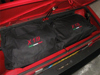 Picture of bag with embroidered X 1/9 emblem, black