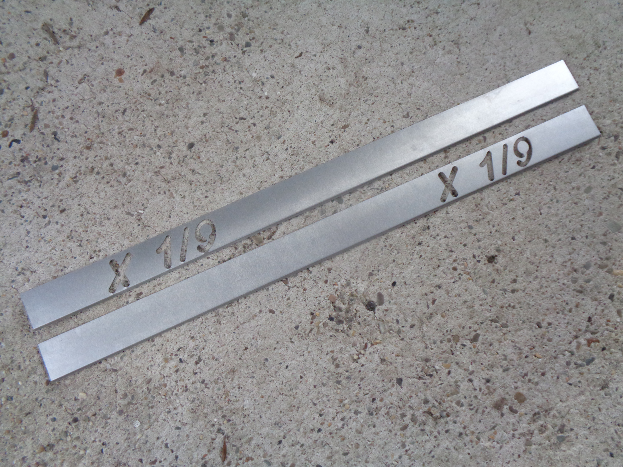 Picture of doorsills, stainless steel, with X 1/9 logo
